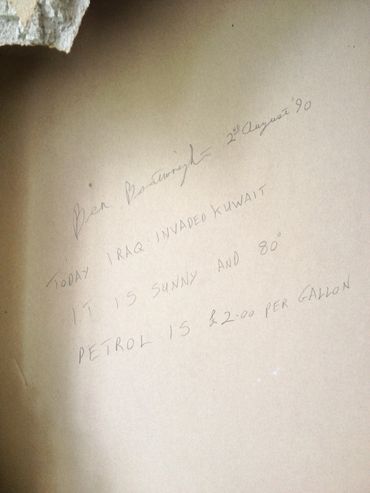 Handwritten note about Iraq invading Kuwait in 1990 with weather and petrol price.