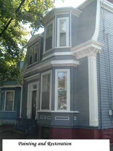 Beautifully restored and freshly painted Victorian-style house exterior.