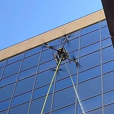 Office building exterior getting cleaned by office building operator