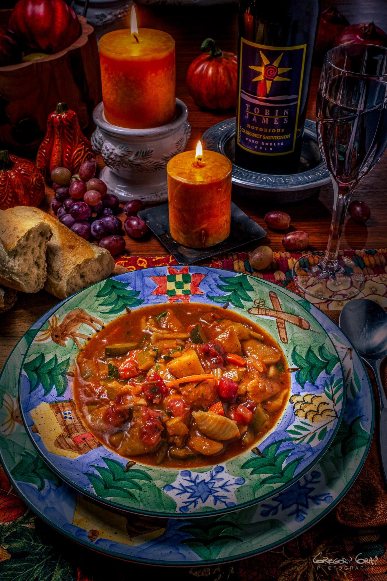 Table top product shot. Photograph of a  bowl of Minestrone soup taken for a cookbook cover.