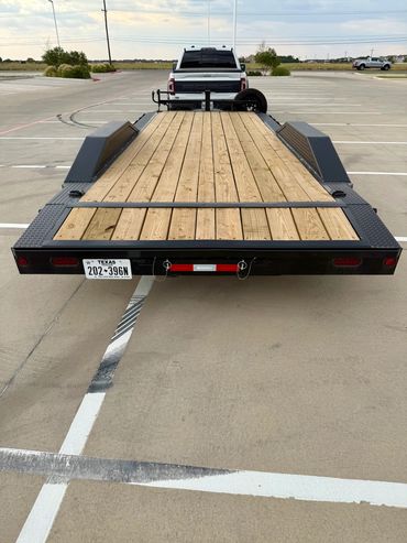 22ft Iron Bull car hauler rental in Lubbock, TX with drive-over fenders & heavy-duty ramps, 14K GVWR