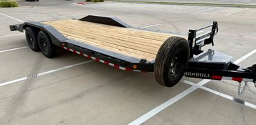 22ft Iron Bull car hauler rental in Lubbock, TX with drive-over fenders & heavy-duty ramps, 14K GVWR