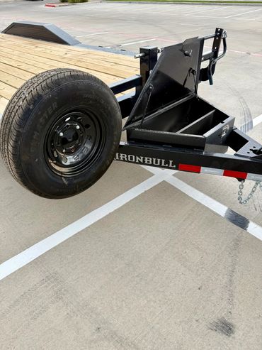 22ft Iron Bull car hauler rental in Lubbock, TX with drive-over fenders & heavy-duty ramps, 14K GVWR