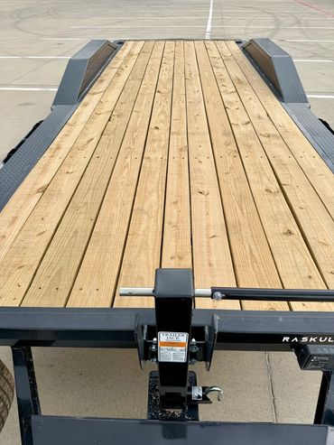 22ft Iron Bull car hauler rental in Lubbock, TX with drive-over fenders & heavy-duty ramps, 14K GVWR