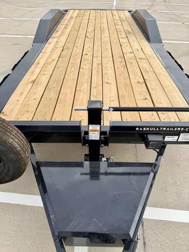 22ft Iron Bull car hauler rental in Lubbock, TX with drive-over fenders & heavy-duty ramps, 14K GVWR