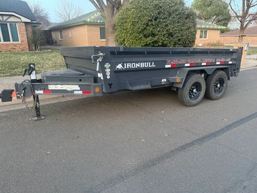 Heavy-duty dump trailer in Lubbock capable of hauling dirt, gravel, brush, and construction debris.