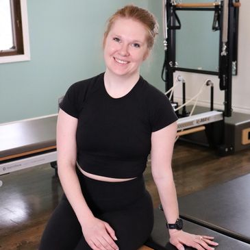 Kiersten Zimbeck smiling at the camera at Thrive Pilates.