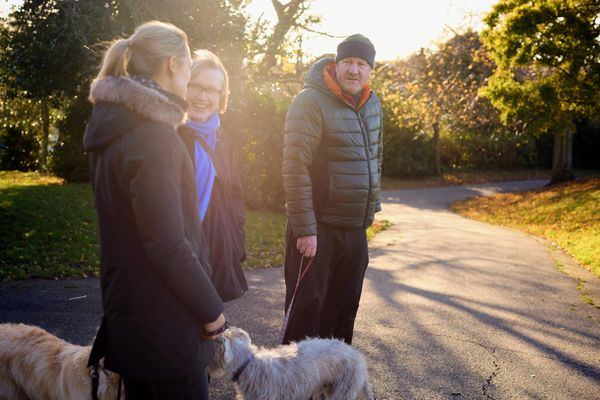Caroline from Dogs Do Therapy with two therapy dogs and two clients