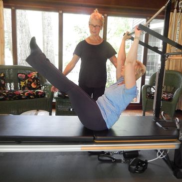 Teaser exercise at Plymouth Canton Pilates during Private CADILLAC session