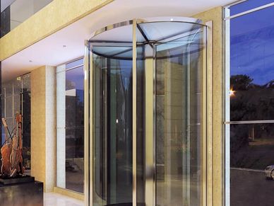 A revolving door at the entrance of a hotel
