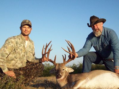 This is an image of two men on a successful whitetail deer hunt.