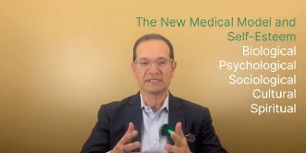 Man explains the new medical model emphasizing self-esteem and multiple dimensions of health.