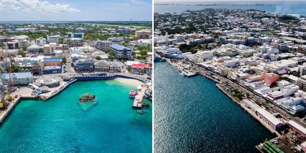 Aerial views of coastal city with clear blue waters and urban buildings.