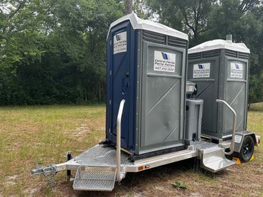 Dual porta potty trailer with handwashing station and steps