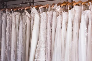 white dresses hanging on hangers
