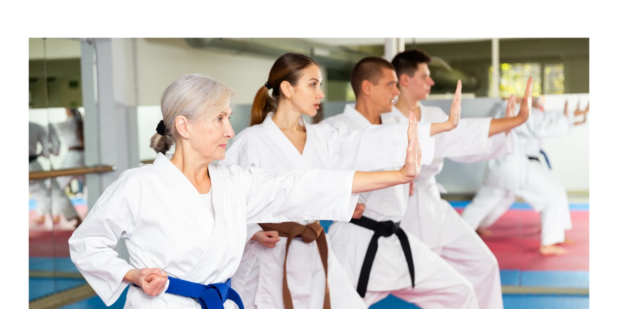 Group of adults in a Karate pose