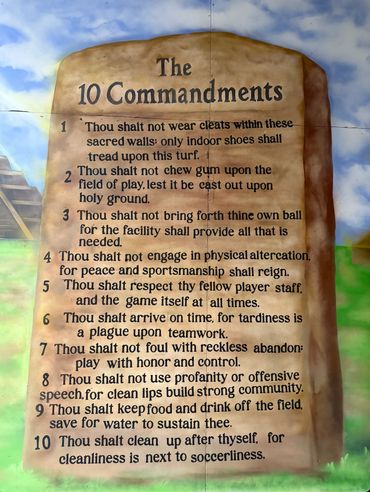 Mural of the 10 Commandments for soccer players emphasizing respect, cleanliness, and sportsmanship.