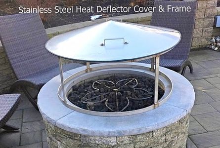 alt="fire pit heat deflector"
