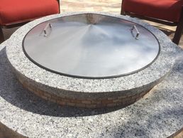 alt="stanless steel fire pit cover"