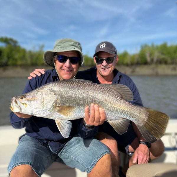 Smiles all round with their Barramundi catch!