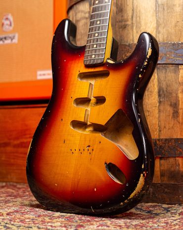 Relic'd '59 3-Tone Sunburst on a 1959 Stratocaster Body with Medium-Heavy Aging and Distressing.