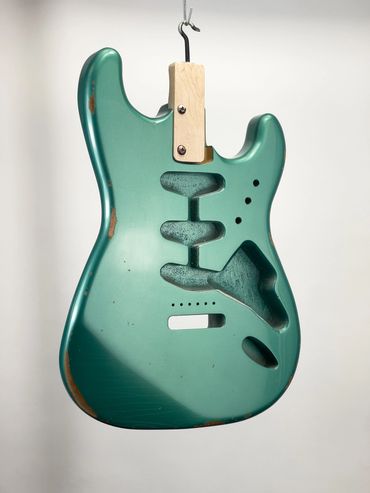 Relic'd Sherwood Green Stratocaster Body with Medium Aging and Distressing. Front.