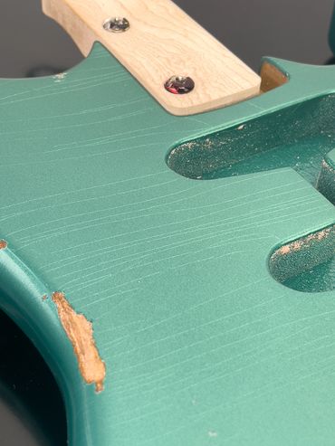 Relic'd Sherwood Green Stratocaster Body with Medium Aging and Distressing. Close Up.