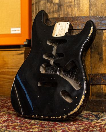 Relic'd Black Stratocaster Body with Medium-Heavy Aging and Distressing. Front Shot.