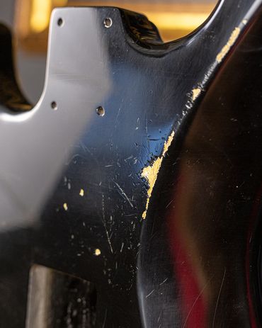 Relic'd Black Stratocaster Body with Medium-Heavy Aging and Distressing. Close Up Shot.
