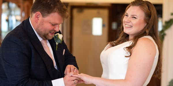 Bride and groom exchange rings during wedding celebrant ceremony in Bristol.