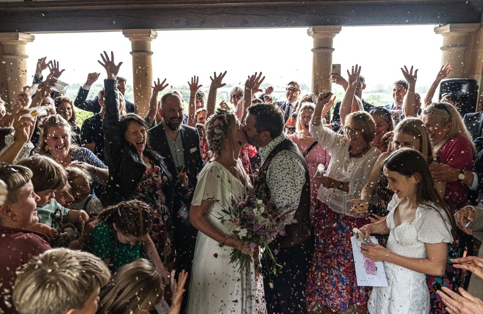 Southville Celebrant wedding ceremony. Bride & groom kiss at Barley Wood, Wrington near, Bristol.