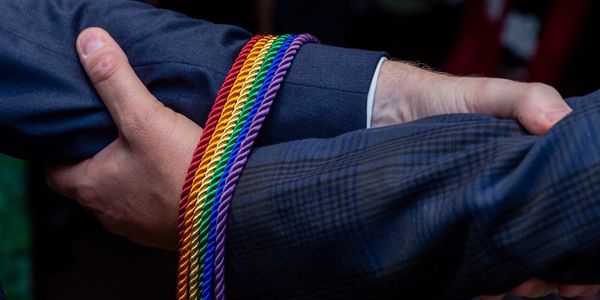 PRIDE flag coloured braids at LGBT+ Bristol wedding. Southville celebrant led wedding ceremony.