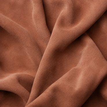 Muted Karoo Clay nubuck leather arranged in soft, irregular natural folds