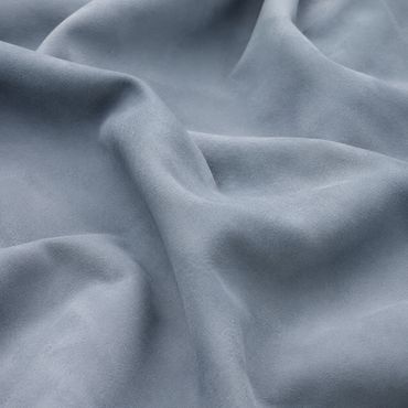 Powder-blue Cape Sky nubuck leather resting in broad, natural folds
