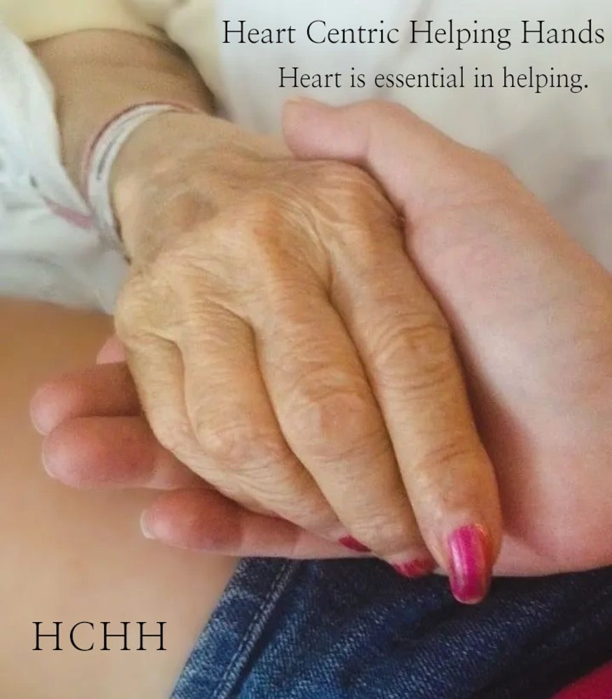 Two hands holding each other, symbolizing heartfelt help and care.