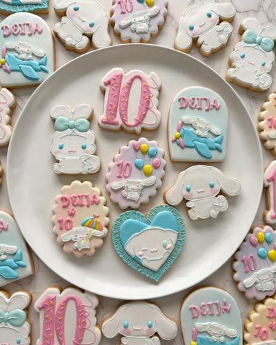 Colorful decorated cookies featuring cute characters and "10" for a birthday celebration.