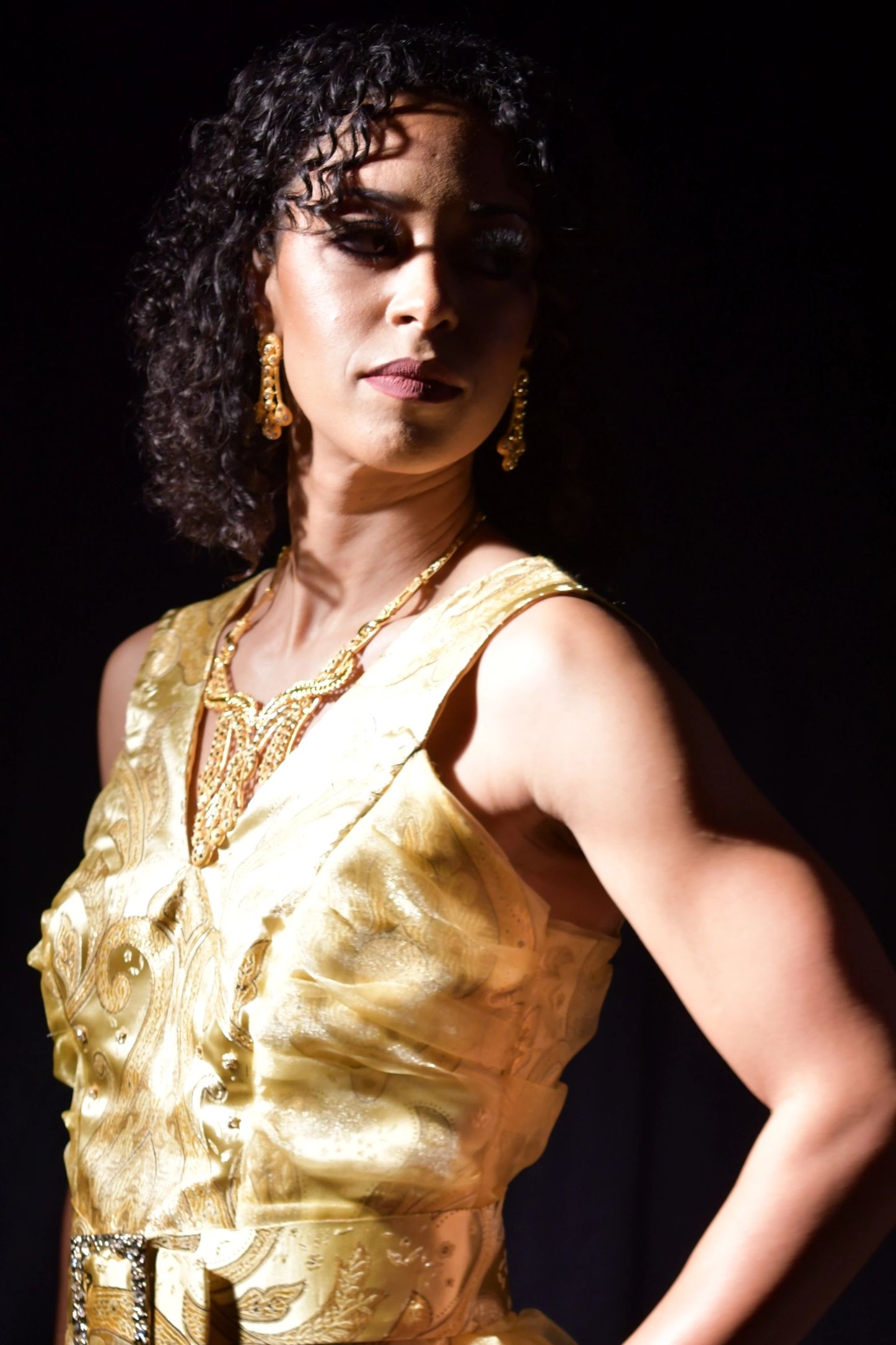 Yellow printed brocade with gold organza insets and organza tail.