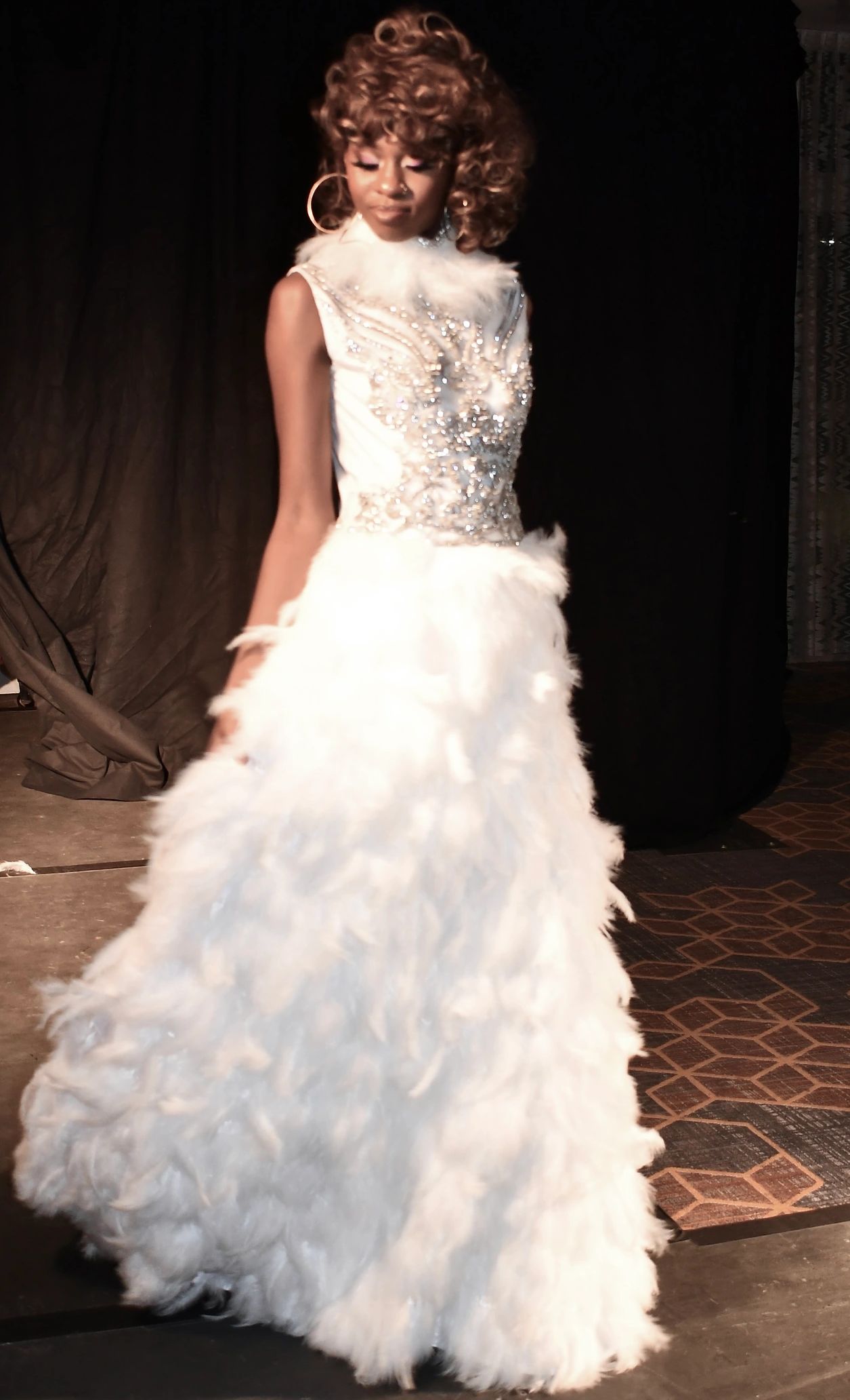 White ostrich feather gown with Swarovski crystals on Habitué silk.
