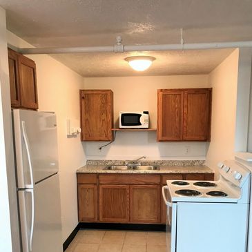 Two bedroom apartments kitchen at Calu