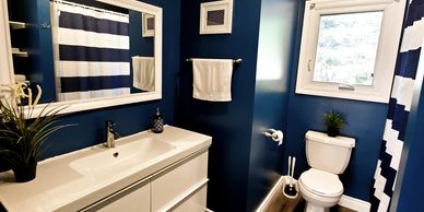 Interior renovations. Navy blue Bathroom
