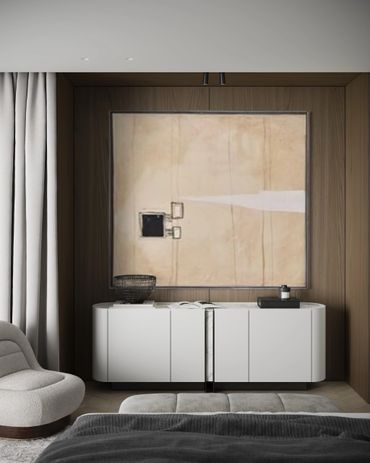 Modern bedroom corner with abstract art and sleek white cabinet under warm wood paneling.