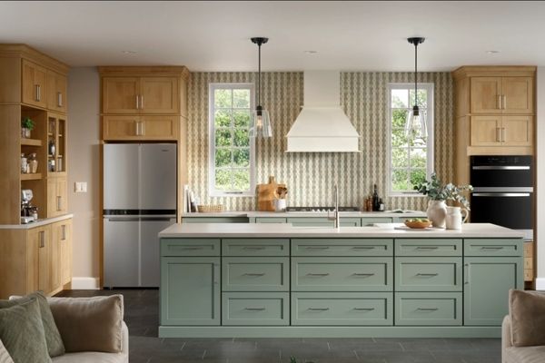 Modern kitchen with green island, wooden cabinets, and stainless steel appliances.