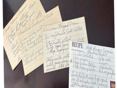 Handwritten recipe cards for various desserts including rice cream and split sugar cookies.
