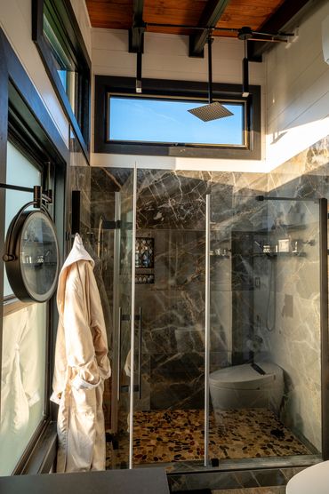 Luxurious, sexy shower with 10 foot high rainfall head is like standing under a waterfall.