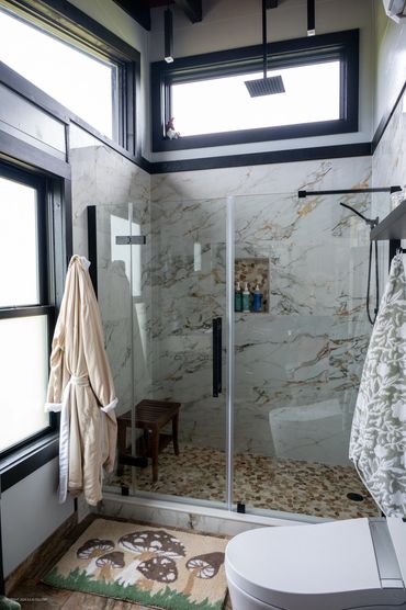 Luxurious large format tile shower w/ rainfall head feels like standing under a waterfall!