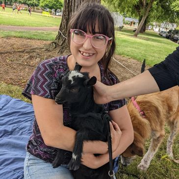 Morgan with Luna, our dwarf goat in 2022