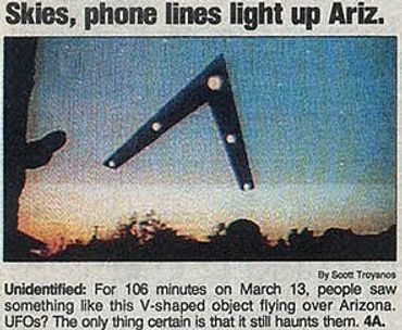 A newspaper clipping of a triangle UFO depicting the "Phoenix lights" UFO encounter in Phoenix, Ariz