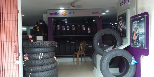 Tire shop displaying Apollo brand tires with Manchester United branding.