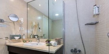 Bathroom with bath and shower