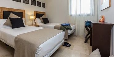 Twin beds and study desk with chair